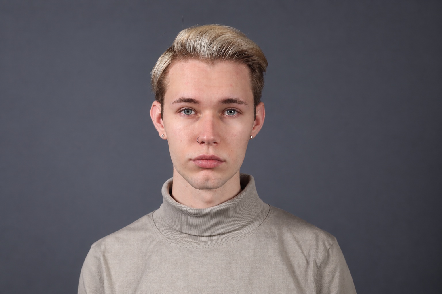 Dakota Weid in a gray turtleneck